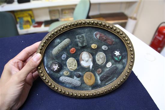 A collection of Italian Grand Tour lava, cameo and pietra dura roundels and plaques, 8.75in.